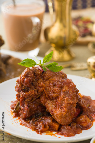 curry chicken, indian cuisine with traditional food items on bac