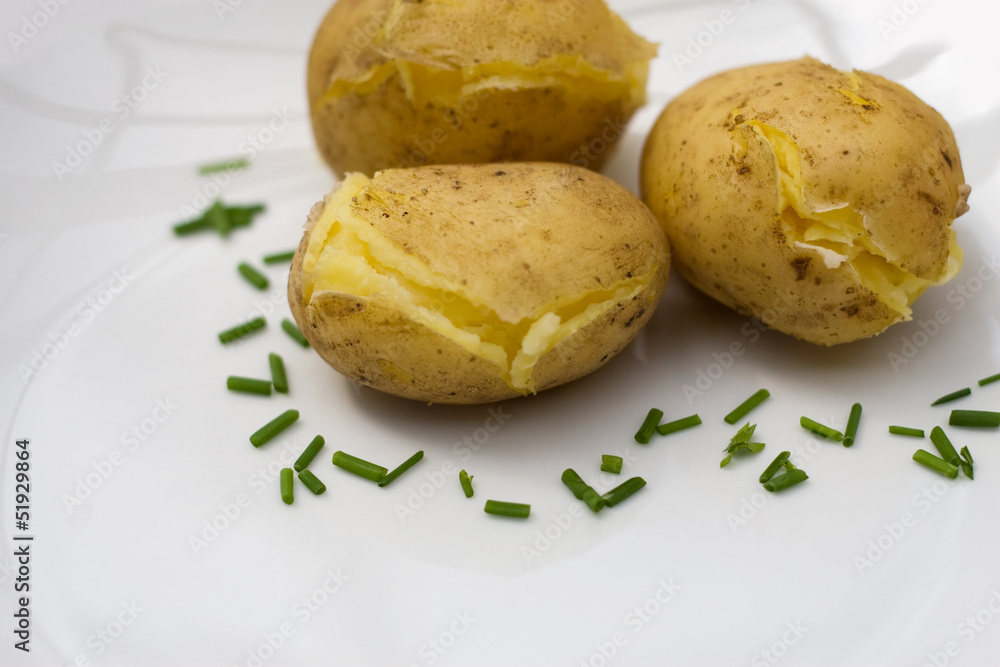 baked potatoes on white plate baked potatoes on white plate