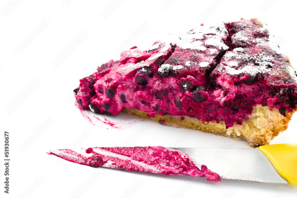 Obraz premium A piece of blueberry pie and knife isolated on white background