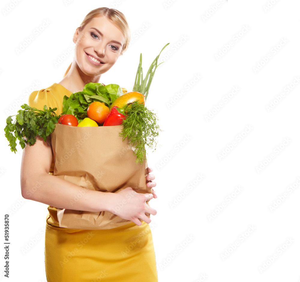 Young woman with a grocery shopping bag. Isolated on white backg Young woman with a grocery shopping bag. Isolated on white backg