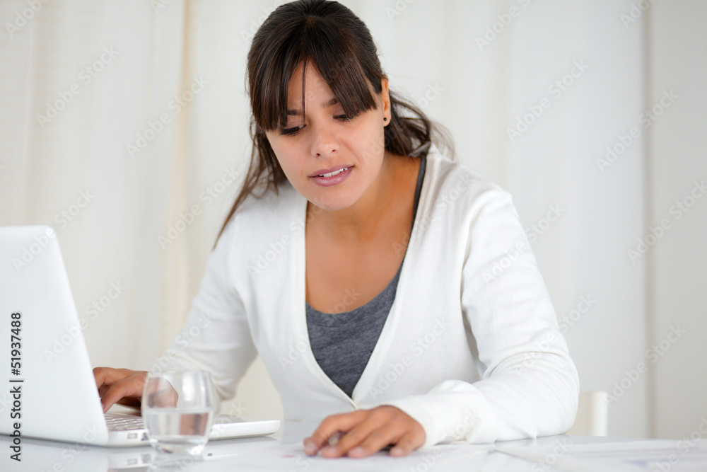 Charming woman working at office with a laptop Charming woman working at office with a laptop