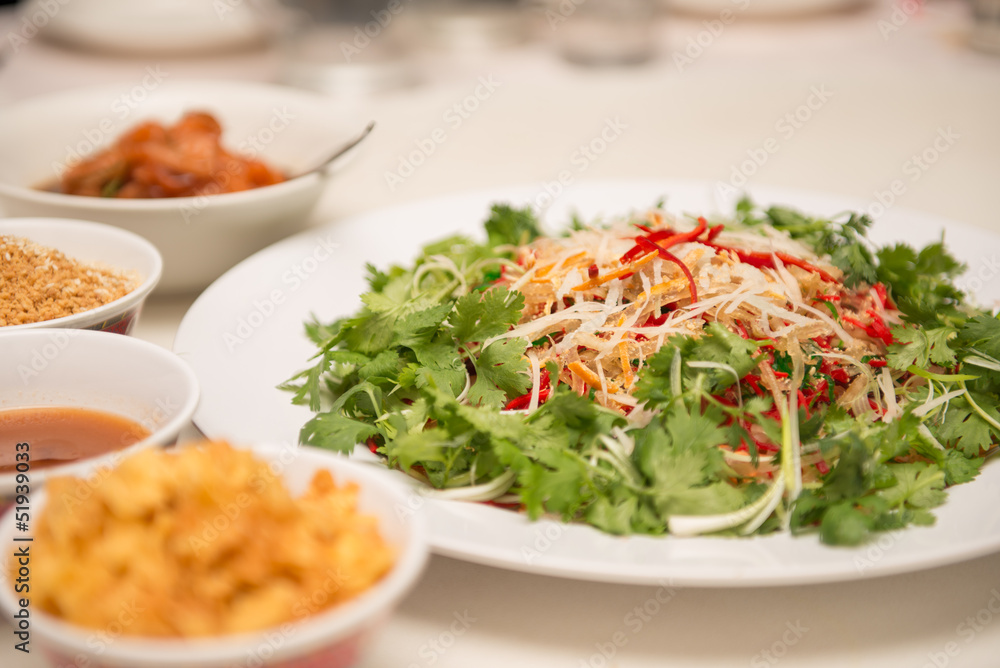 Raw fish salad (also known as Yu Sheng or Lo Hei), a Chinese New Raw fish salad (also known as Yu Sheng or Lo Hei), a Chinese New