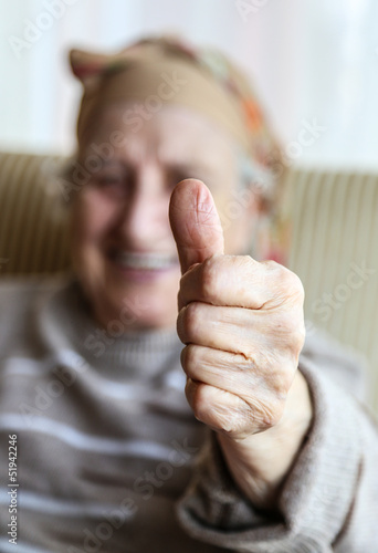 senior woman showing okay hand sign and smiling for you