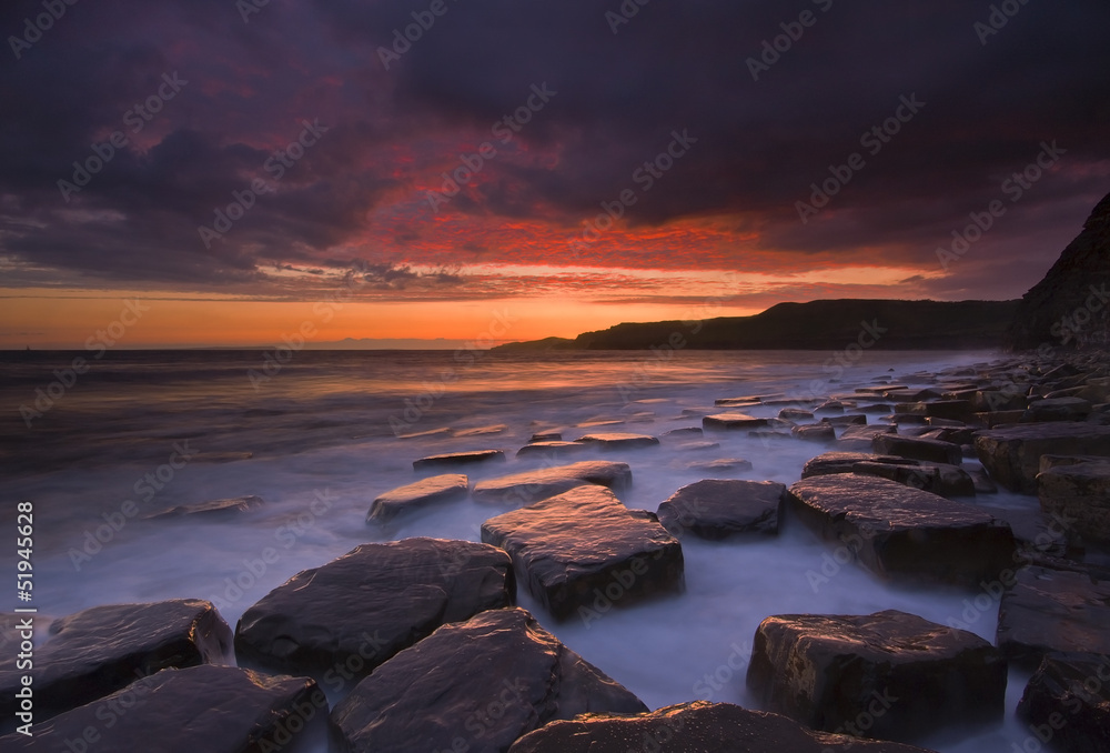 Kimmeridge, dorset, sunset with reflection on rocks