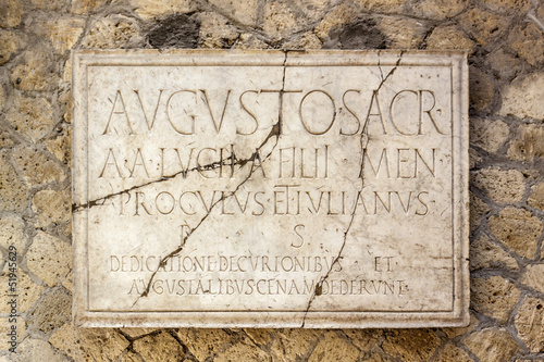 Latin inscription on plaque in Herculaneum near Vesuvius Italy