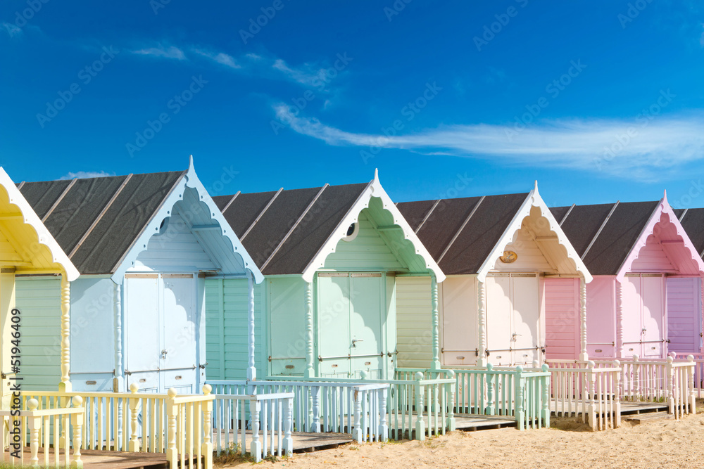 Fototapeta premium Traditional British beach huts on a bright sunny day
