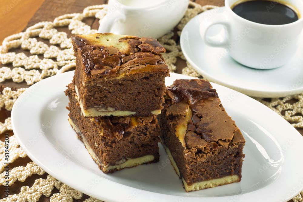Cream cheese brownies on a white plate Cream cheese brownies on a white plate
