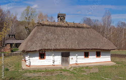Ancient traditional ukrainian rural cottage with a straw roof #51948680