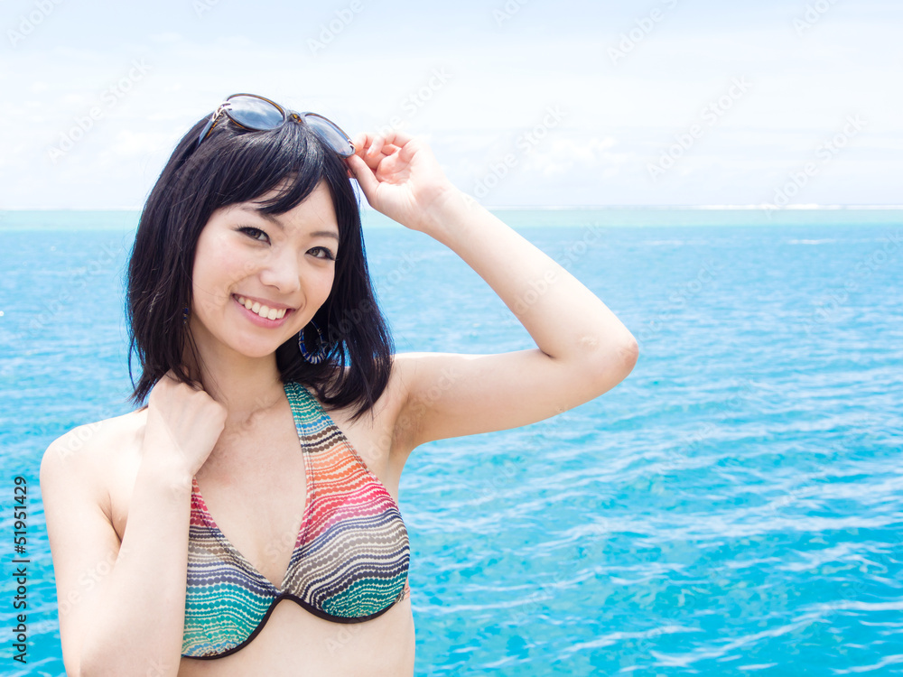 a beautiful asian woman in the ocean