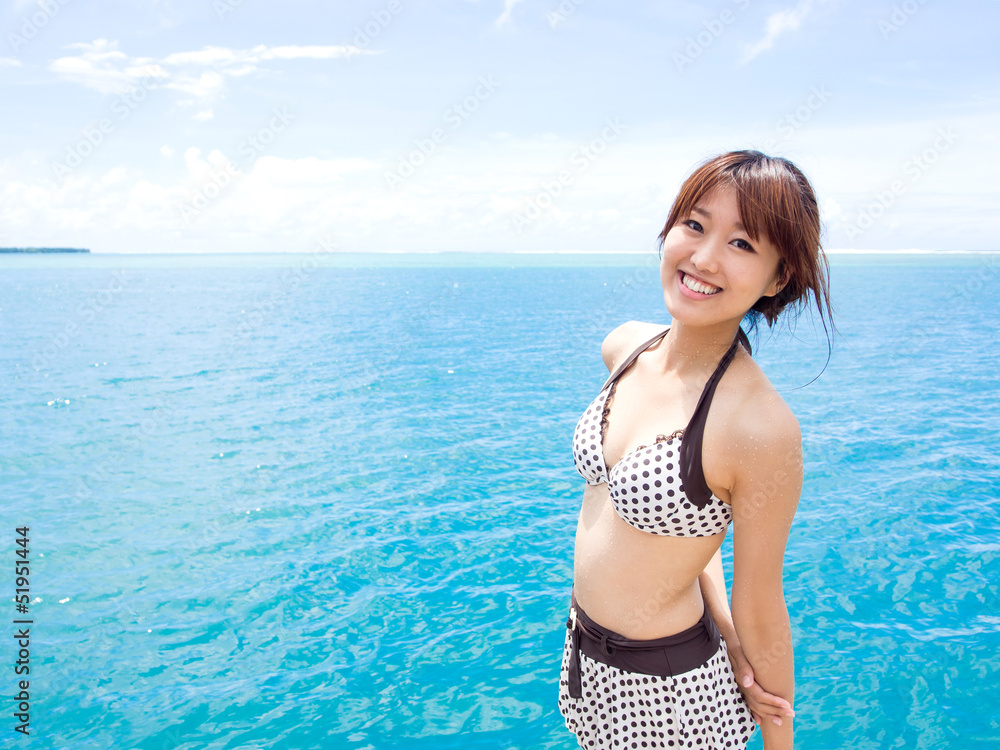 a beautiful asian woman in the ocean
