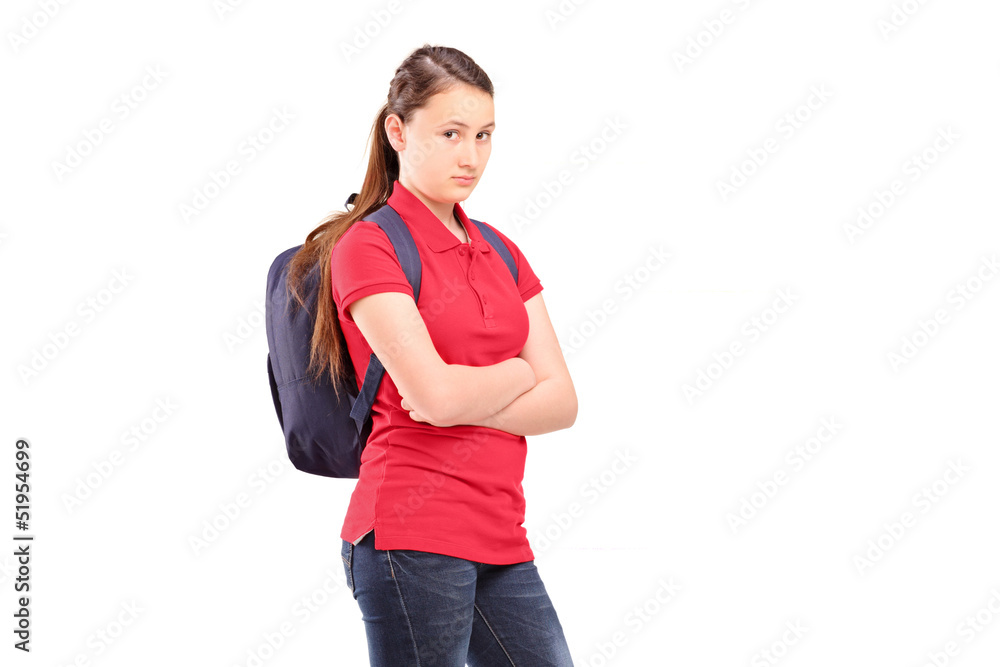 A sad female teenager with a backpack A sad female teenager with a backpack