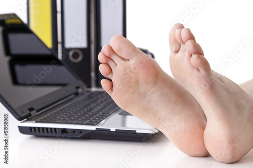 Bare feet on the desk