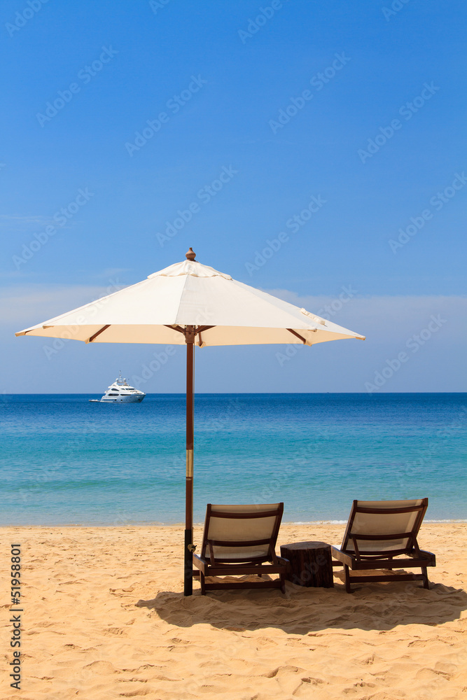 beds and umbrella on the beach