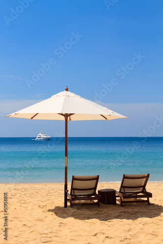beds and umbrella on the beach