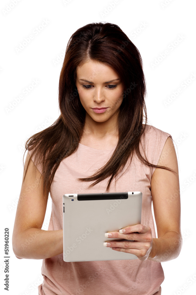 Brunette woman using a computer tablet Brunette woman using a computer tablet