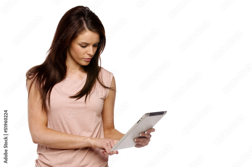 Brunette woman using a computer tablet Brunette woman using a computer tablet