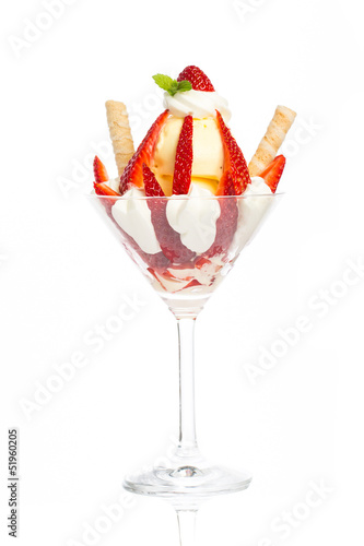 sundae with vanilla ice cream and strawberries