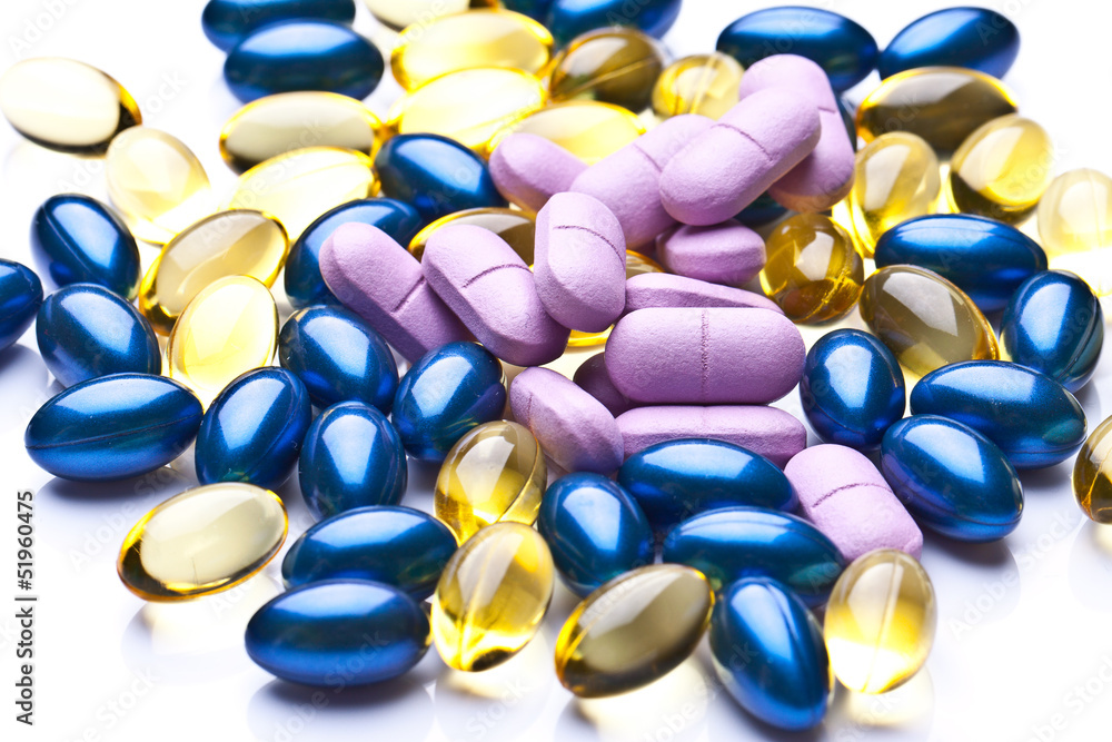 colorful vitamin gel capsules isolated on whiteback ground colorful vitamin gel capsules isolated on whiteback ground