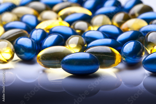 colorful vitamin gel capsules isolated on whiteback ground  photo