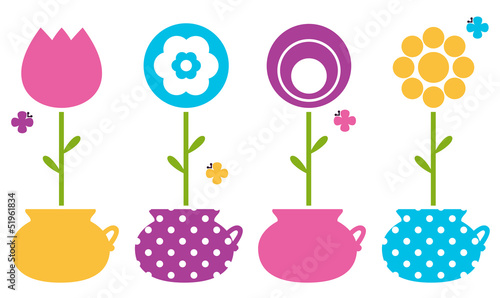 Cute spring flowers in flower pots isolated on white
