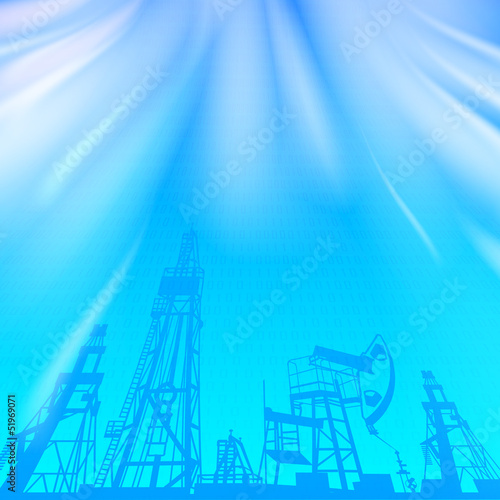 Oil rig and pump over blue luminous ray