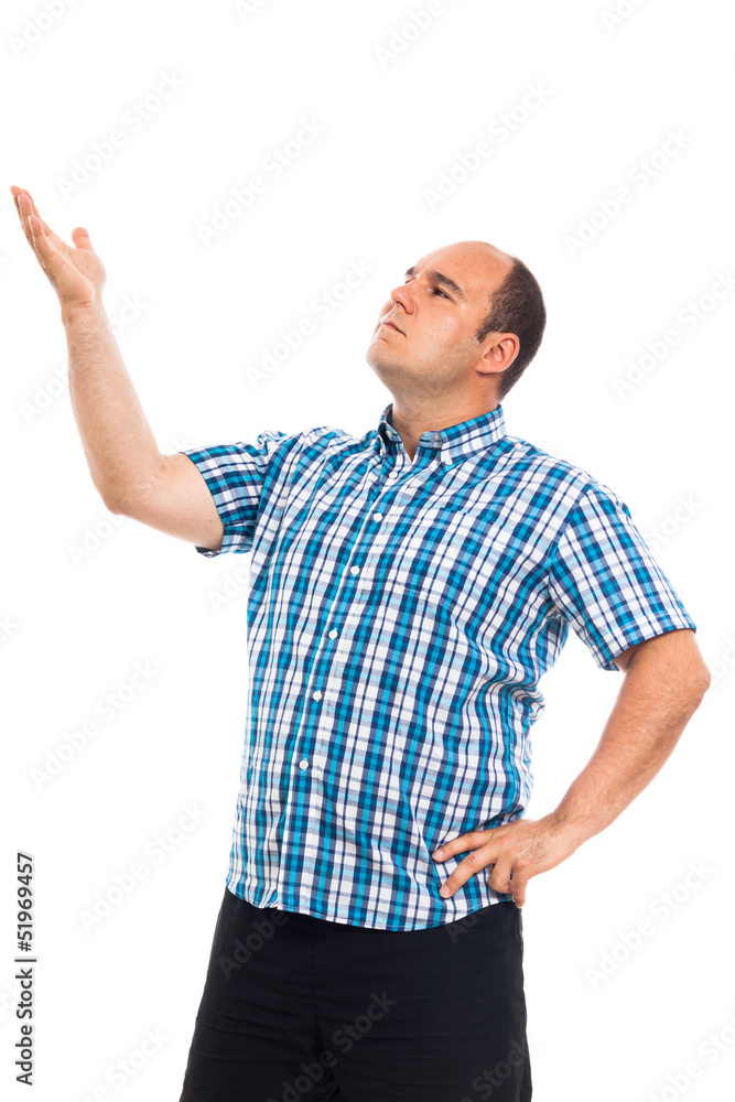 Serious pensive man pointing up Serious pensive man pointing up