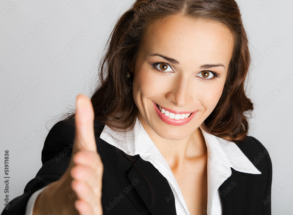 Businesswoman giving hand for handshake Businesswoman giving hand for handshake