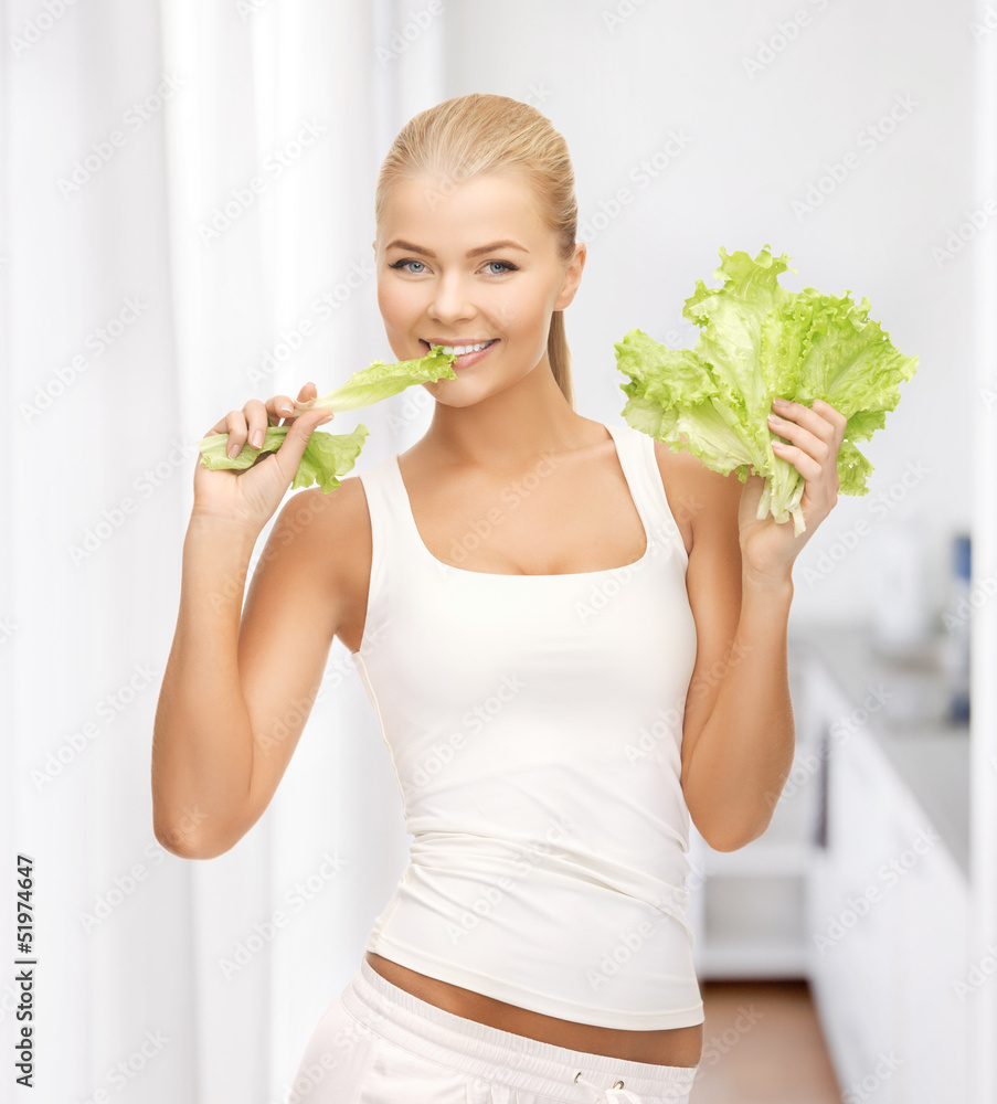 woman biting lettuce woman biting lettuce