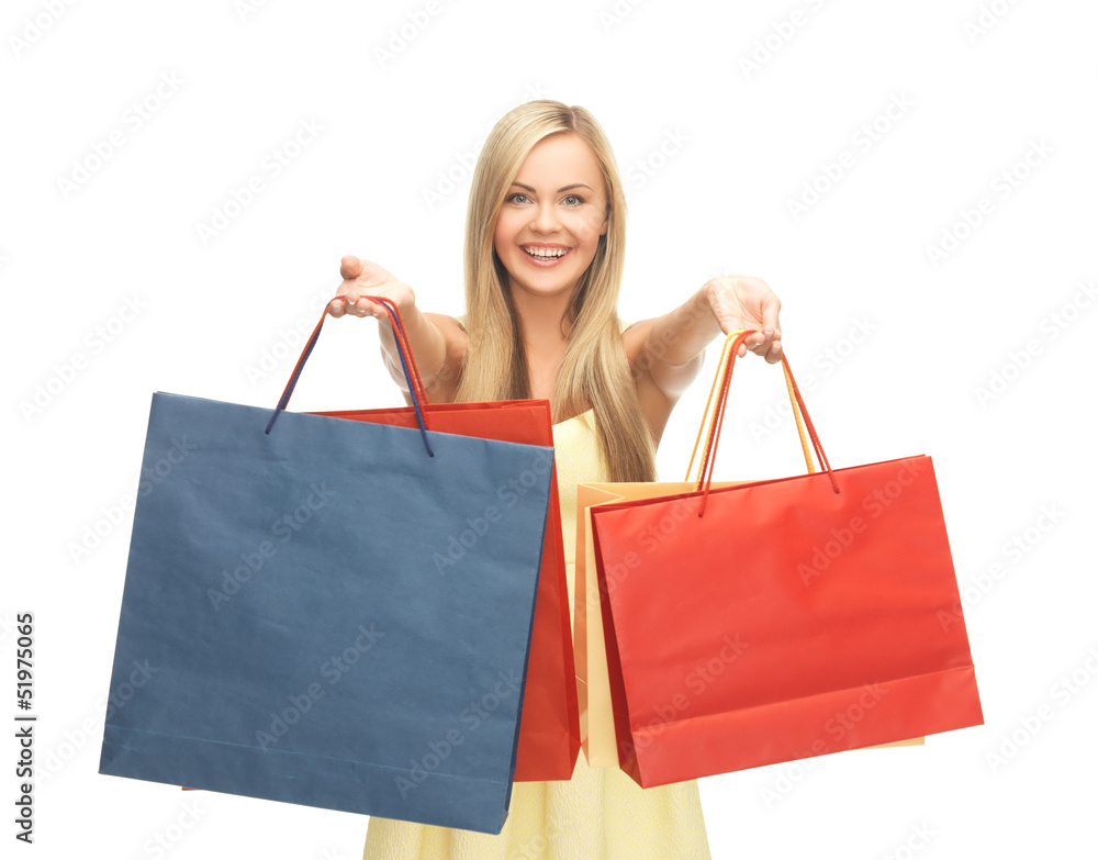 excited woman with shopping bags