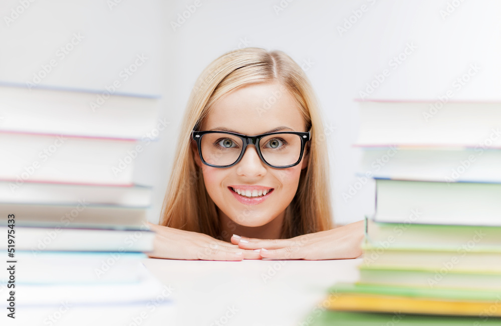 student with stack of books