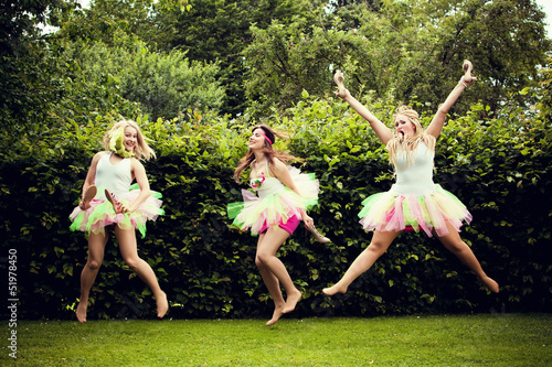 beautiful happy young women jumping.