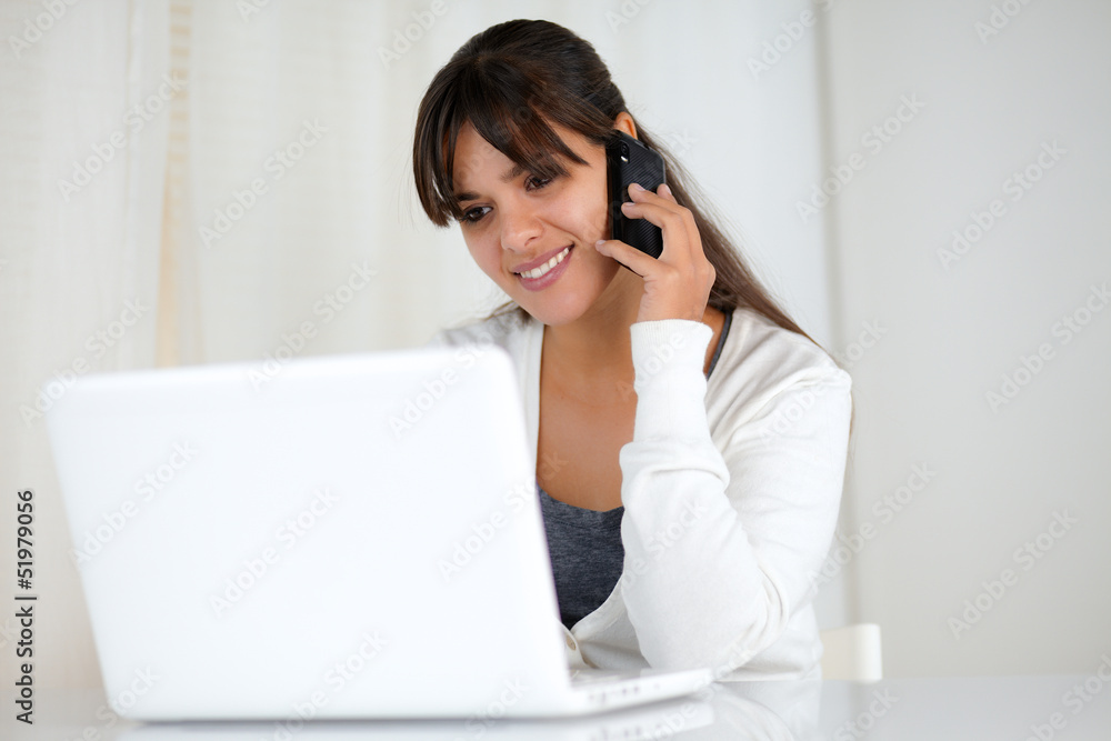 Charming young woman reading on laptop screen Charming young woman reading on laptop screen