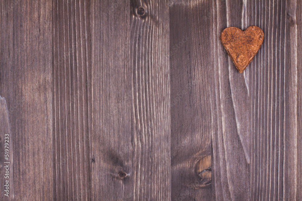 Heart on wood texture background