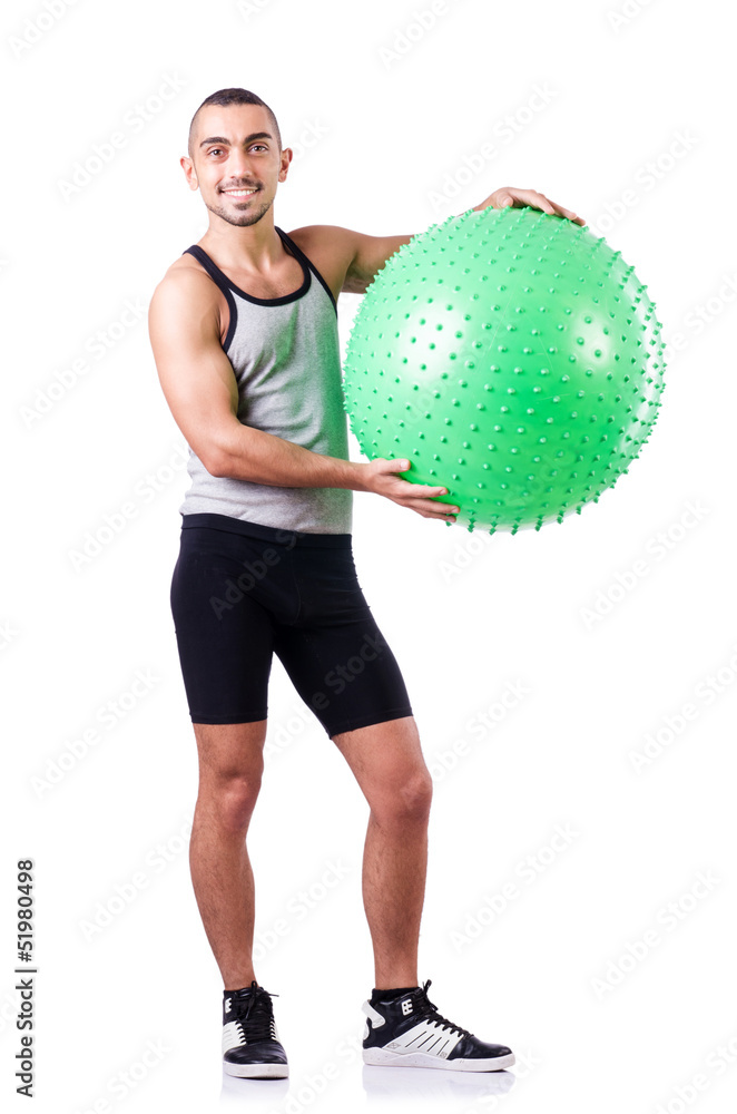 Man with swiss ball doing exercises on white Man with swiss ball doing exercises on white