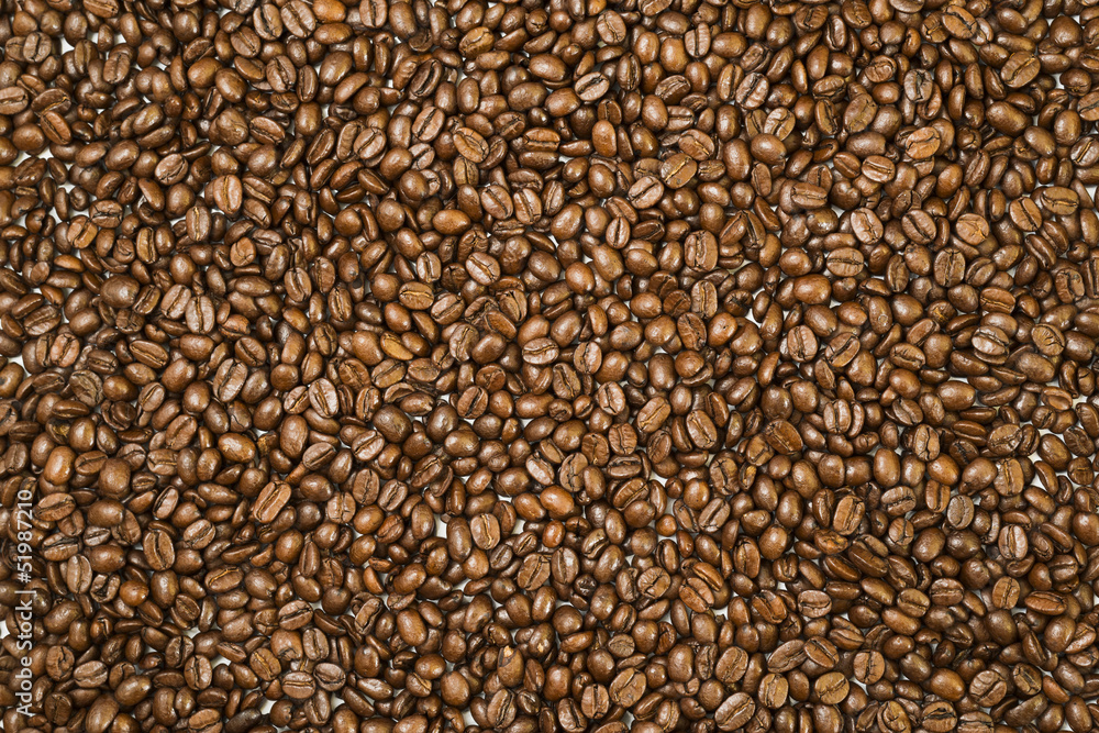 Obraz premium Surface covered with coffee beans as a background