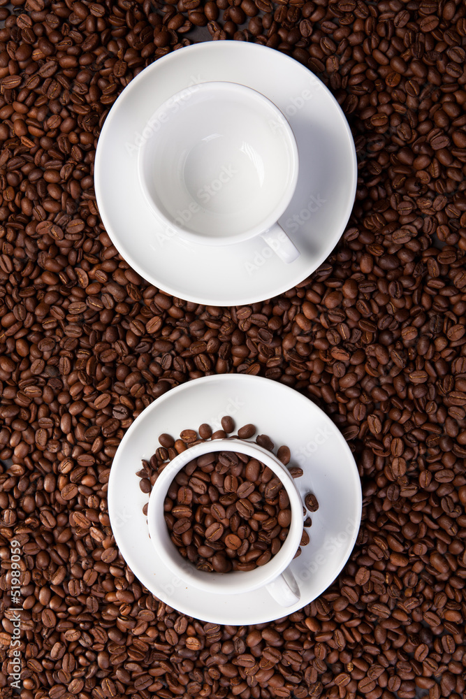 two cup with coffee beans two cup with coffee beans
