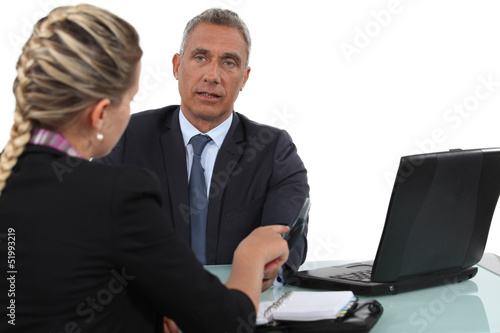 Two office workers in meeting