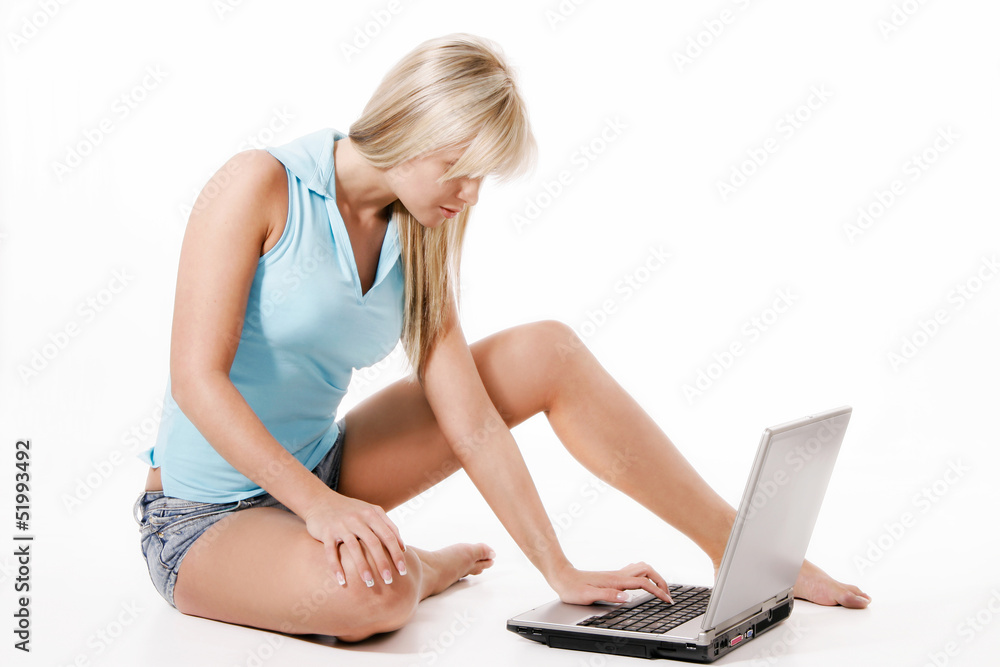 Naklejka premium Young girl working with laptop