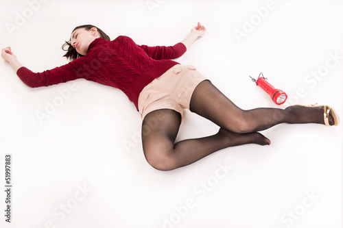 Lifeless brunette lying on the floor