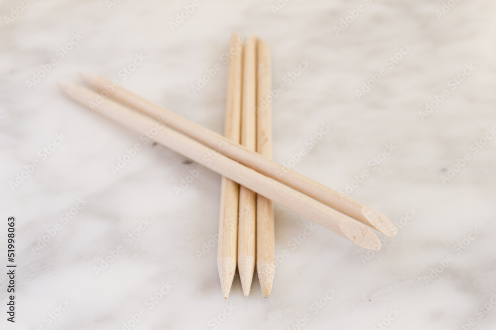 Cuticle pushers on marble orange sticks Cuticle pushers on marble orange sticks