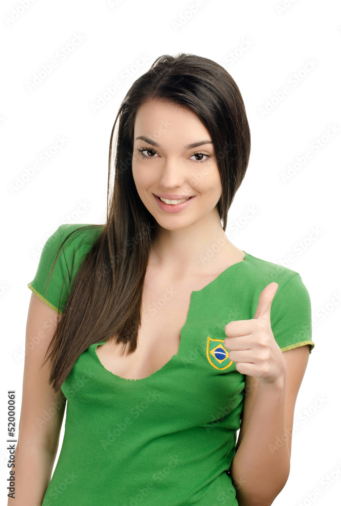 Thumbs up for Brazil.Girl with Brazilian flag on her t-shirt. Thumbs up for Brazil.Girl with Brazilian flag on her t-shirt.