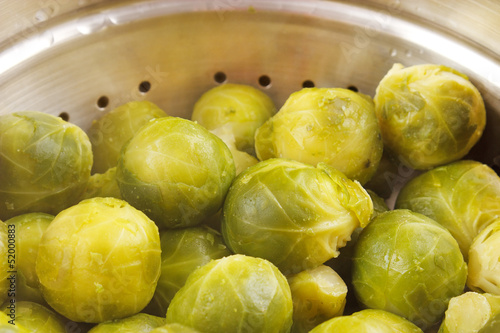 Warm cooked brussels sprouts on steaming pan