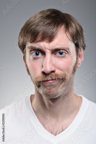 Caucasian Man With Mustache Smirking