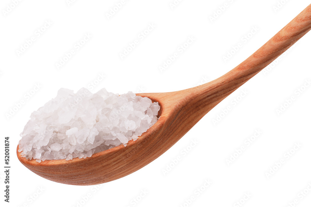 Mineral salt in wooden spoon isolated on white background cutout Mineral salt in wooden spoon isolated on white background cutout