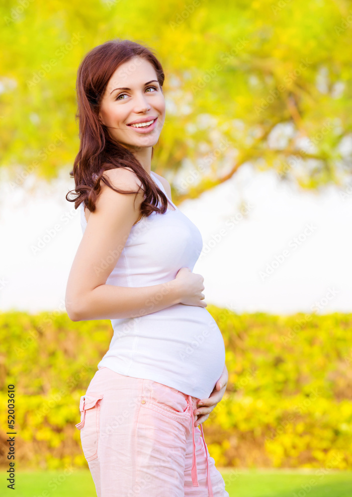 Pregnant woman in park Pregnant woman in park