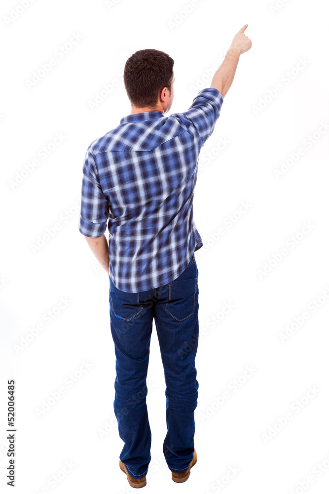 Young casual man pointing towards copyspace, isolated on a white Young casual man pointing towards copyspace, isolated on a white