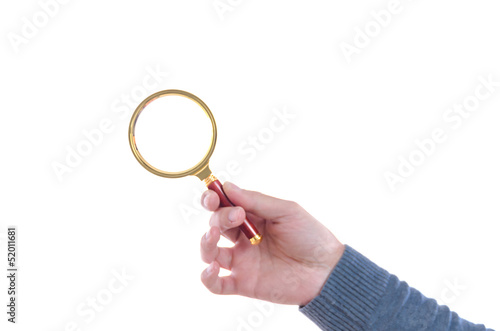 Male hand holding a magnifying glass