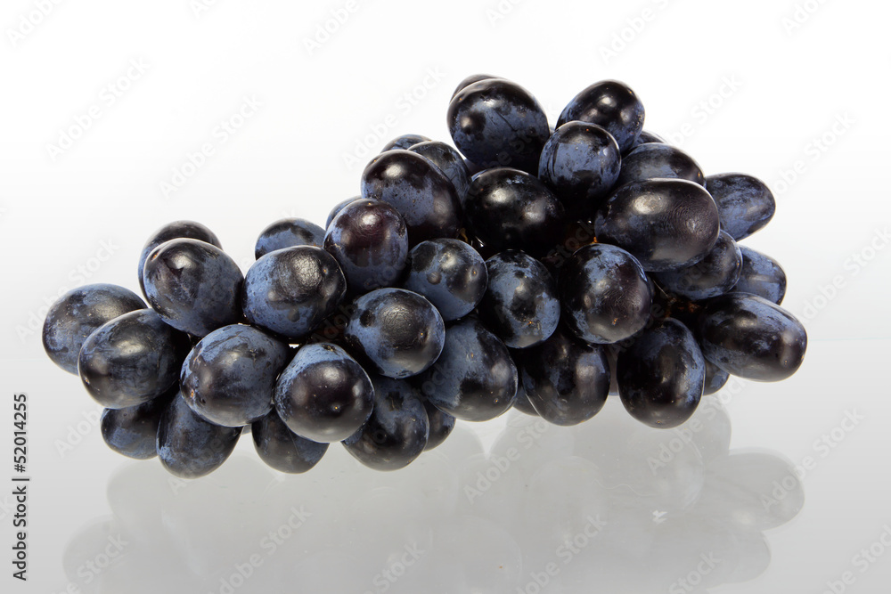 Fresh blue grape fruit on white background