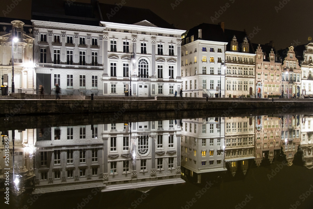 Naklejka premium Reflections of medieval buildings in a canal in Ghent