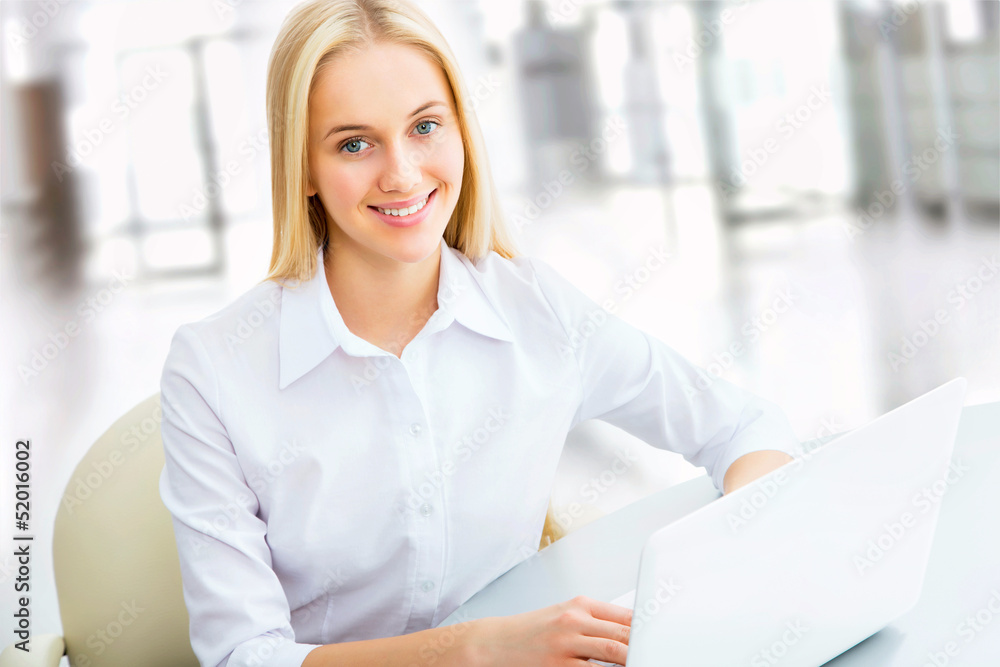 Young business woman using laptop Young business woman using laptop